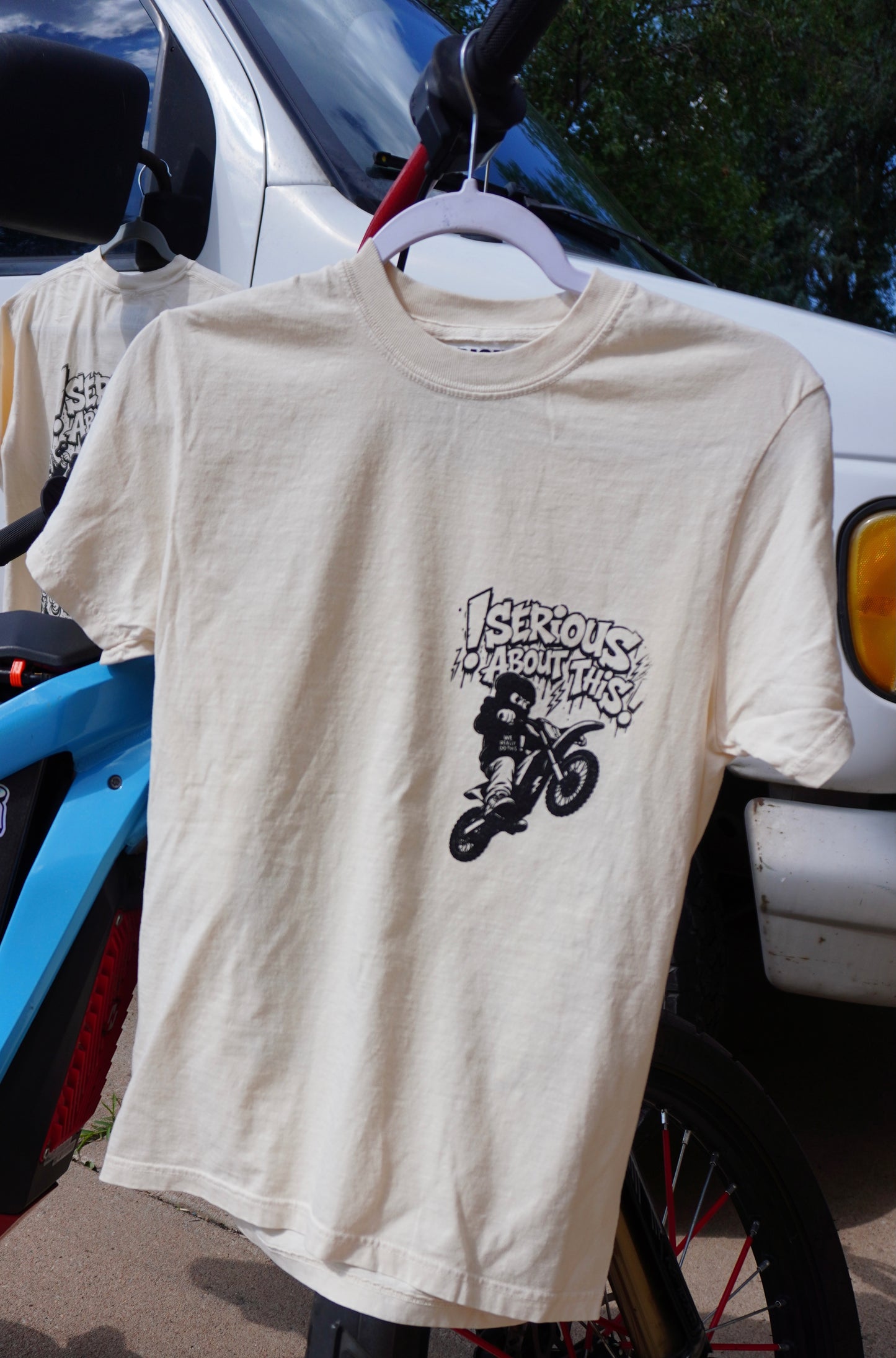 “Riding Regardless” tan and black t shirt
