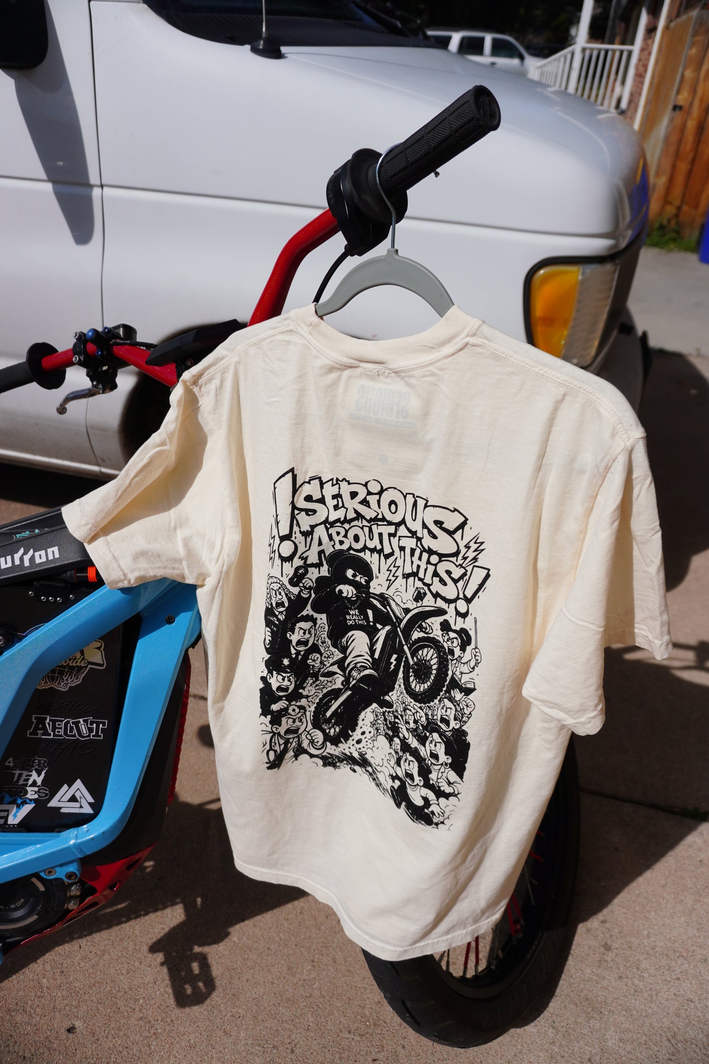 “Riding Regardless” tan and black t shirt
