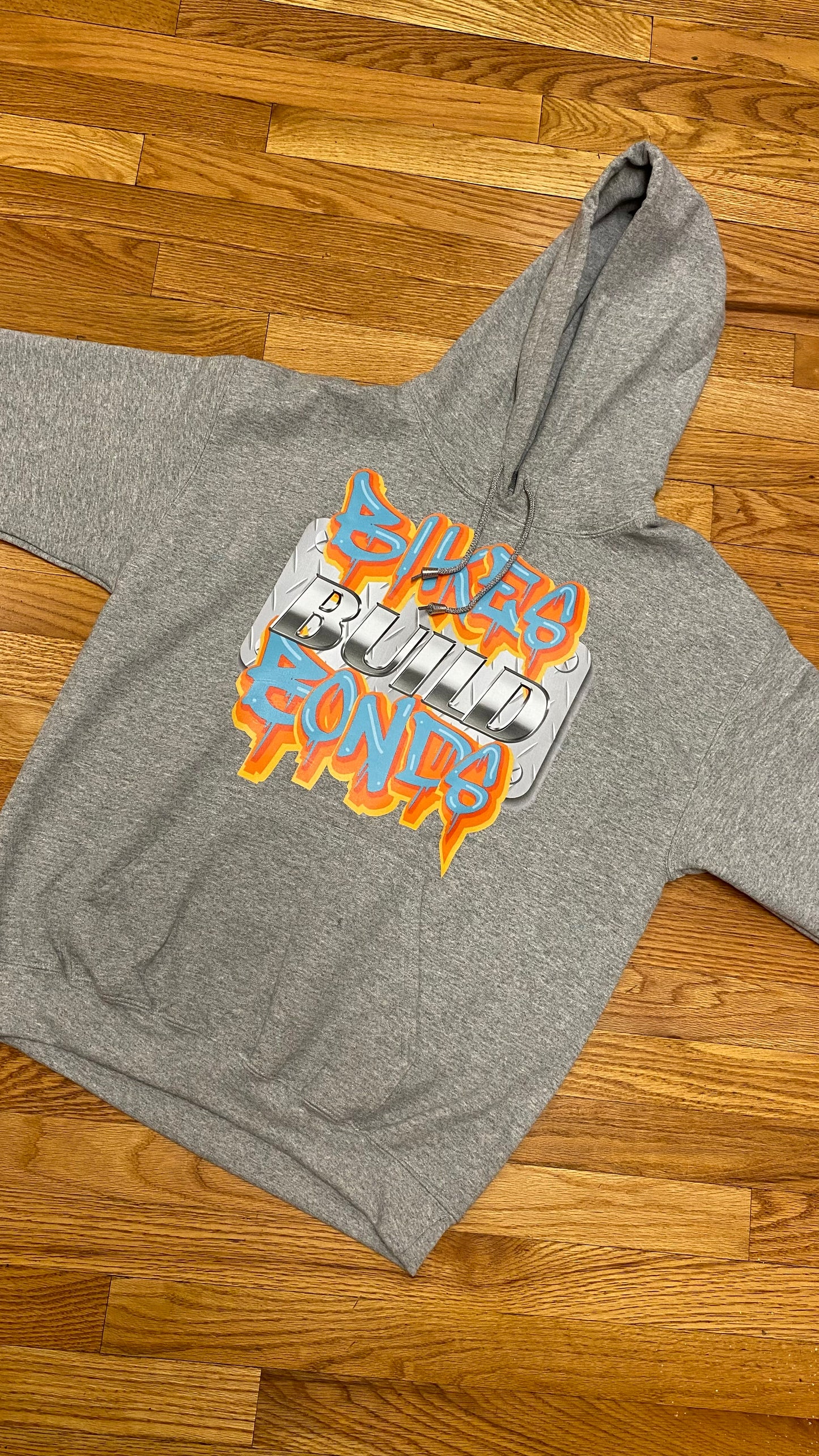 Bikes Build Bonds strong as steel hoodie