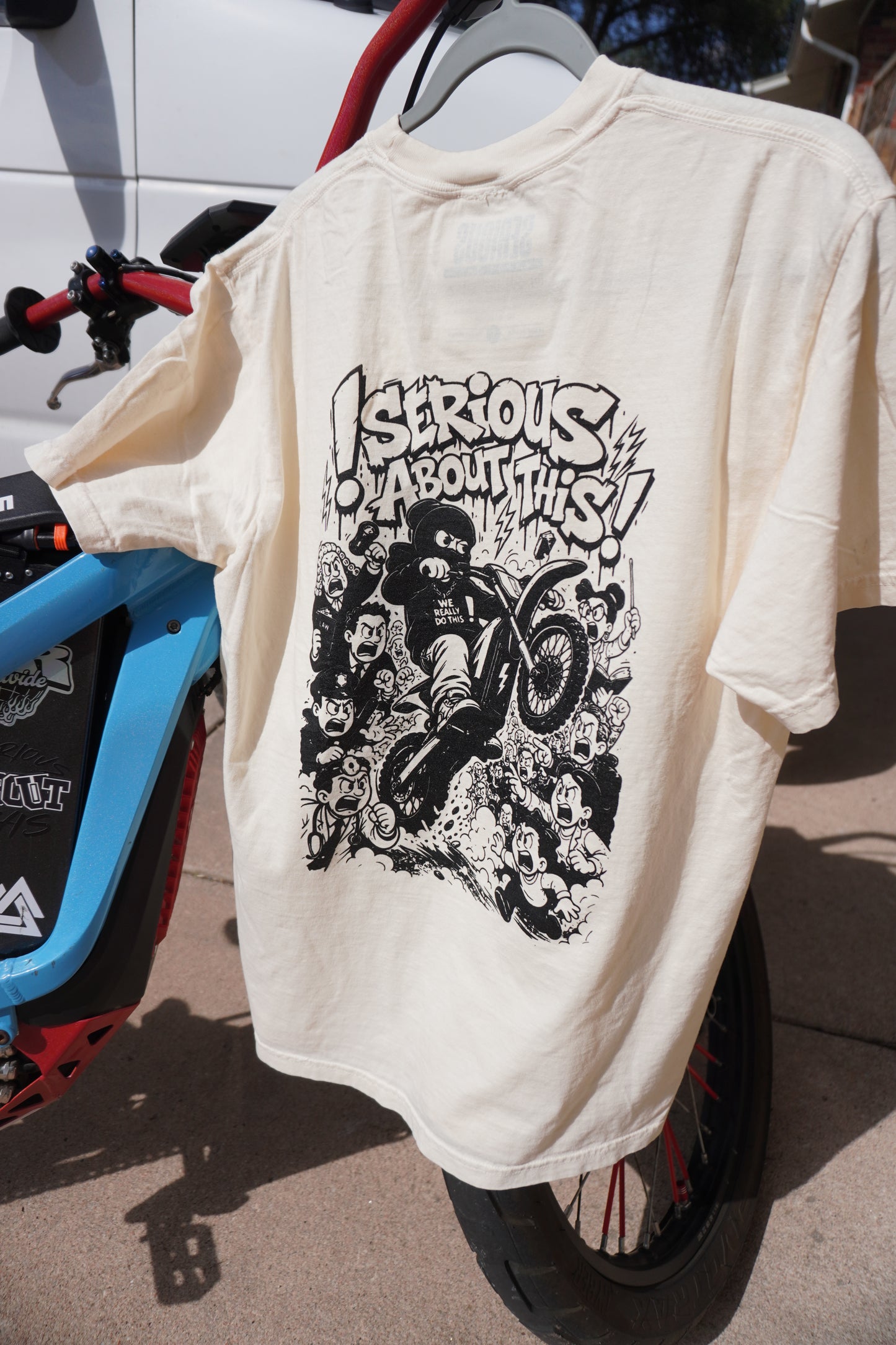 “Riding Regardless” tan and black t shirt
